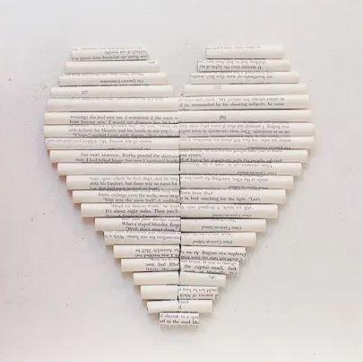 A heart made out of rolled up old book pages. 